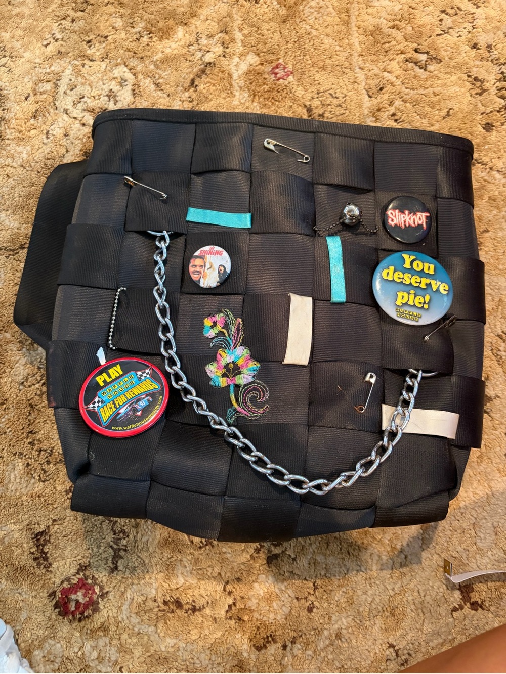 Harveys black woven seatbelt backpack bag styled w/ iconic pins, etc. EUC